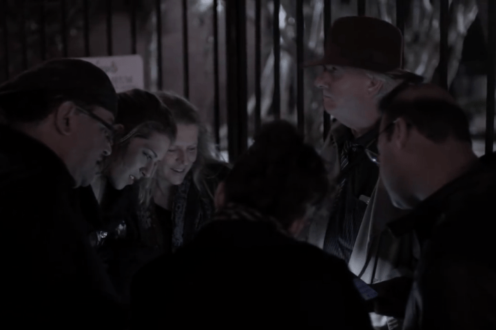 a group of people in a dark room