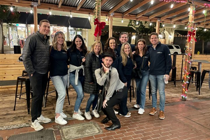 a group of people standing in front of a building