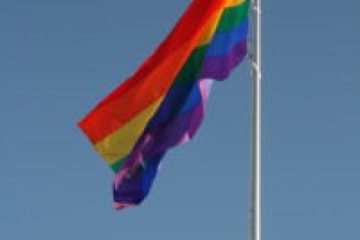 a flag flying on a clear day