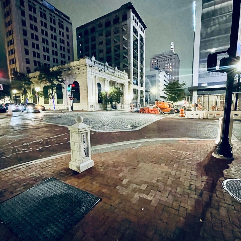 a traffic light sitting on the side of a building