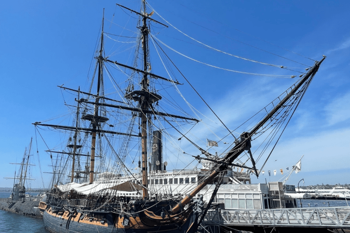 a boat is docked next to a body of water
