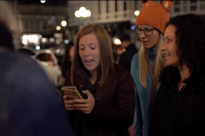 a group of people standing next to a person