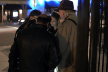 a person standing in front of a store