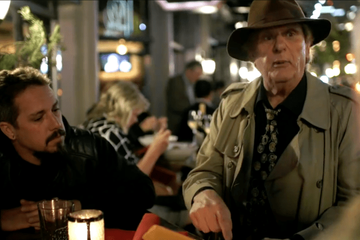 a couple of people sitting at a table