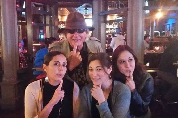 a group of people drinking wine at a restaurant