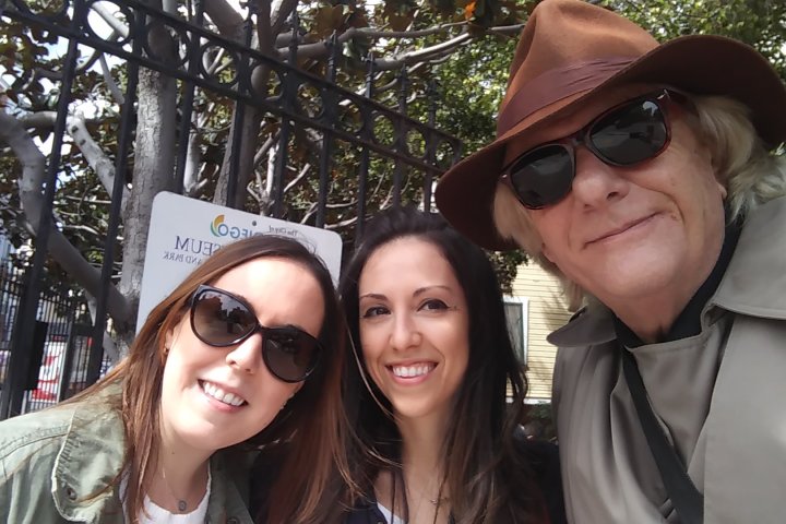 a person wearing a hat and sunglasses